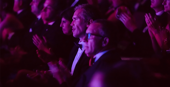 businessmen clapping at performance