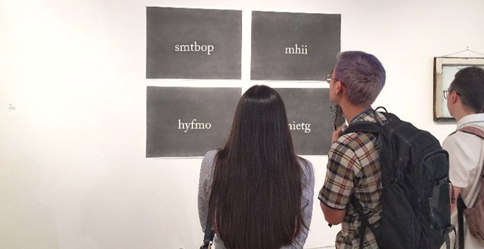 people viewing art at 937 Gallery