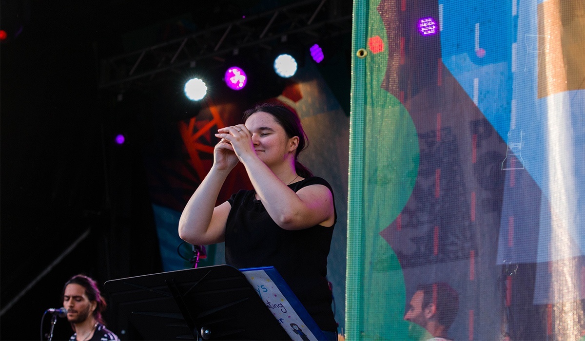 ASL Interpreter translating during a performance