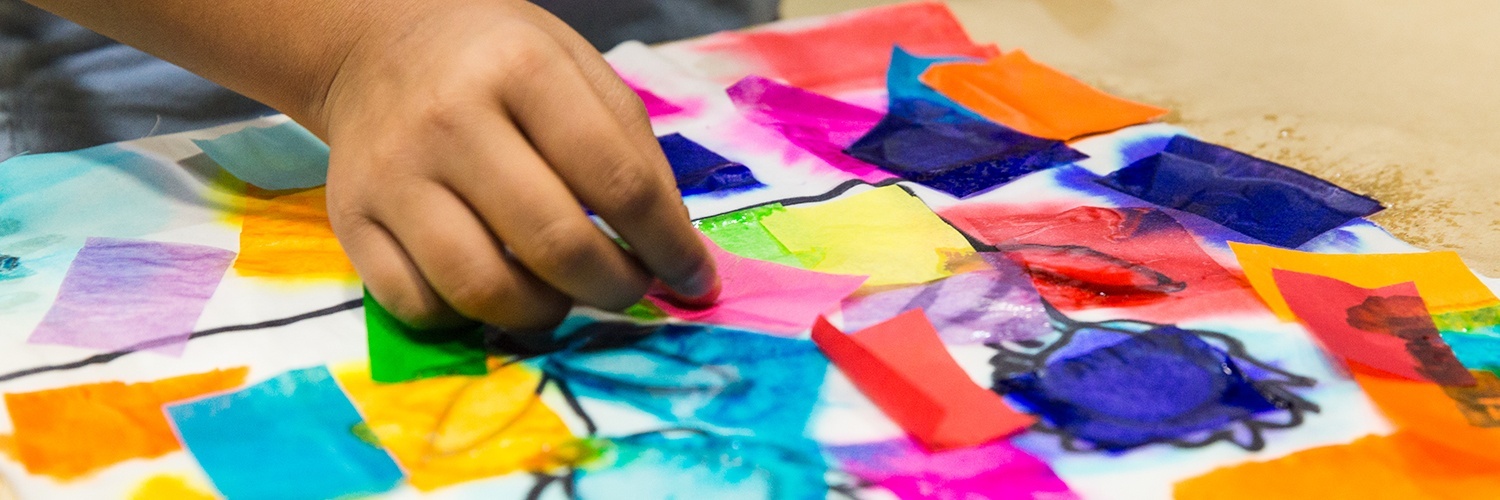 closeup of student making a collage