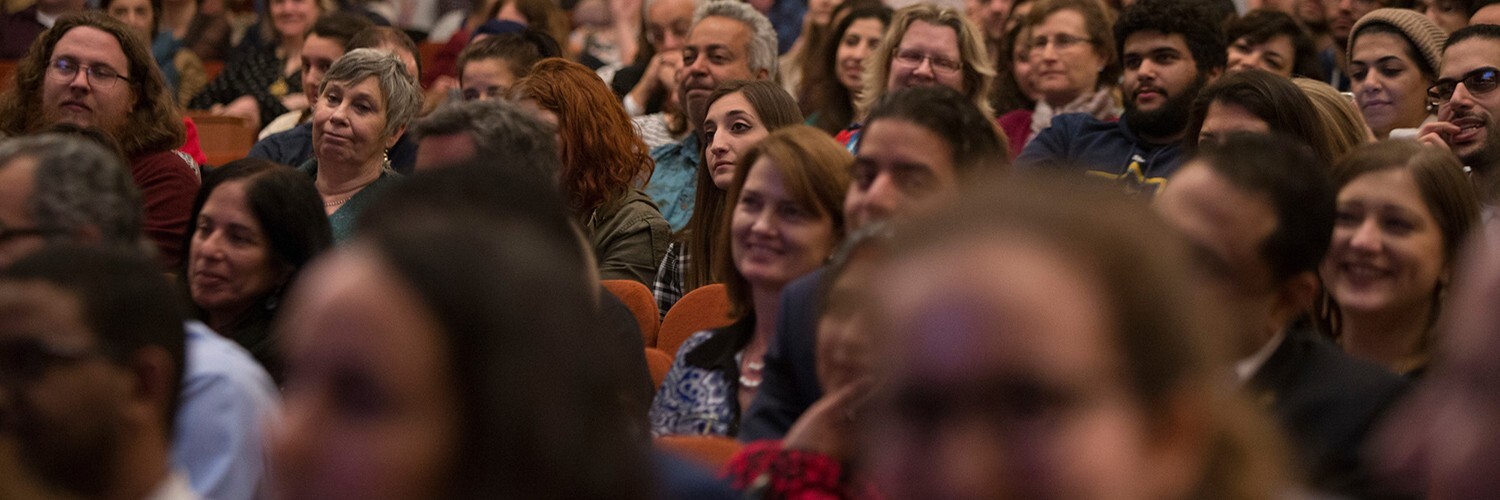 audience listens attentively to lecture