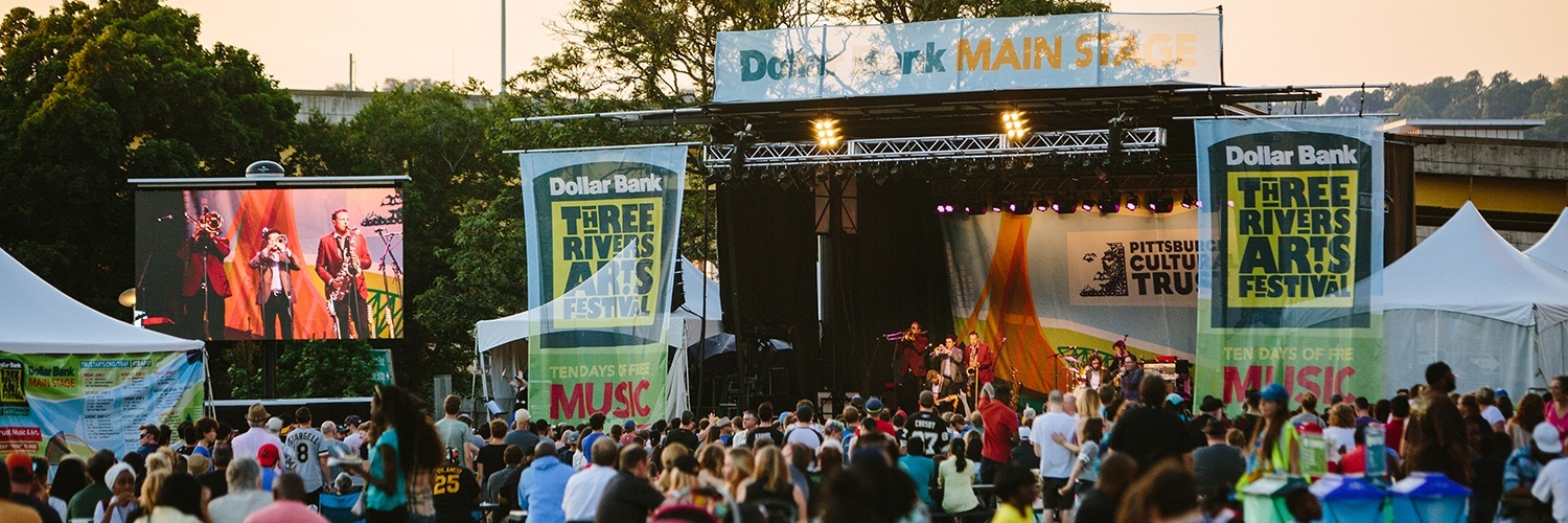 A large crowd watches an Arts Festival performance on the Dollar Bank Main Stage in Point State Park.