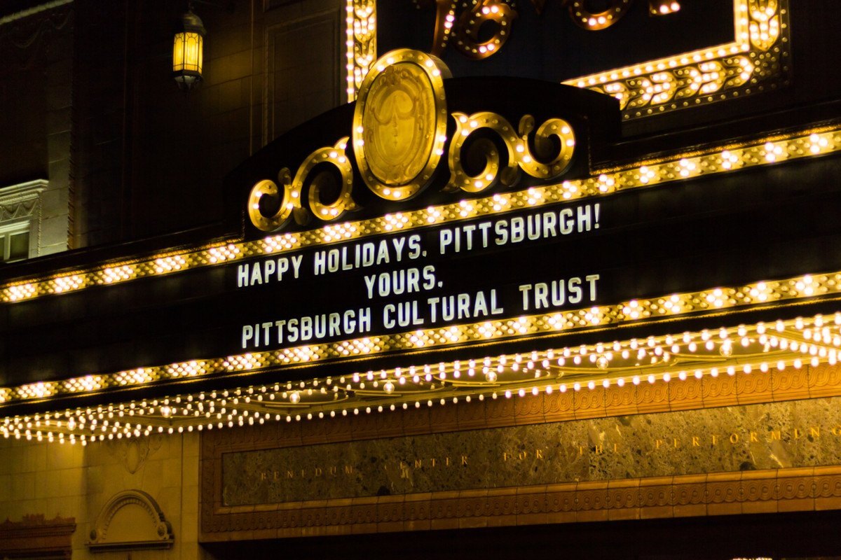 benedum center marquee lit up with message happy holidays, pittsburgh. yours, pittsburgh culutral trust