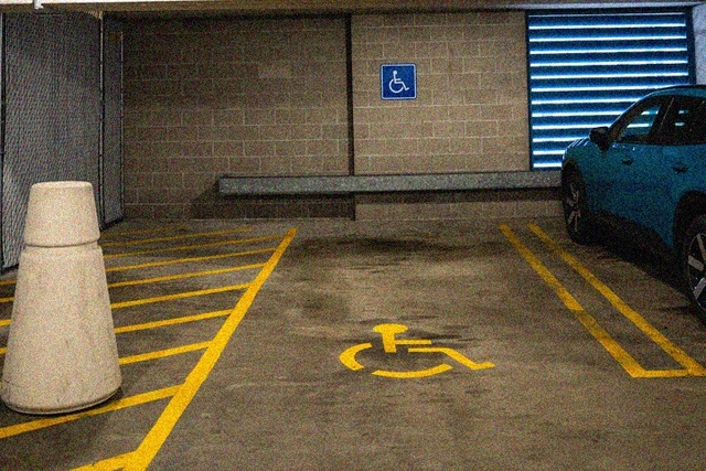 A parking spot with a wheelchair icon painted in the space.
