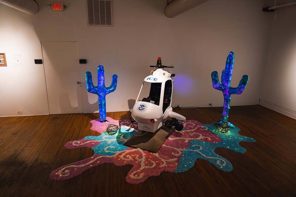 A child's helicopter ride converted to look like an ICE helicopter, complete with fake machine guns