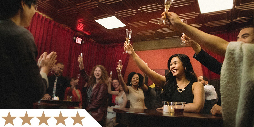 visitors raise their glasses in a toast in liberty magic's vip room