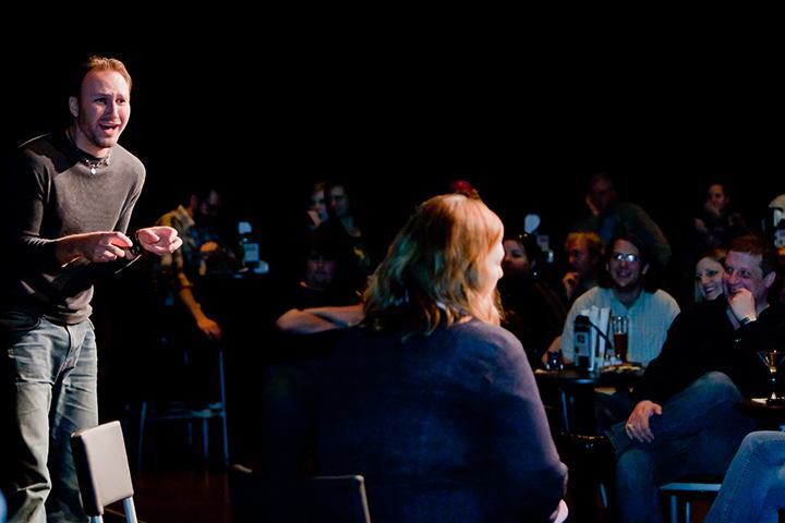 audience laughing at improv comedy show