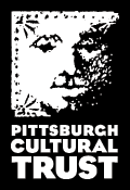 Pittsburgh Cultural Trust logo with white letters and a black background with white lettering and a black background