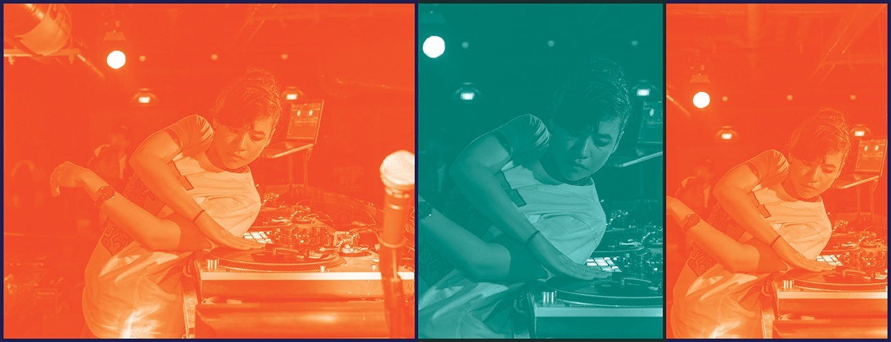 a woman leaning over backwards and spinning a turntable with her hand
