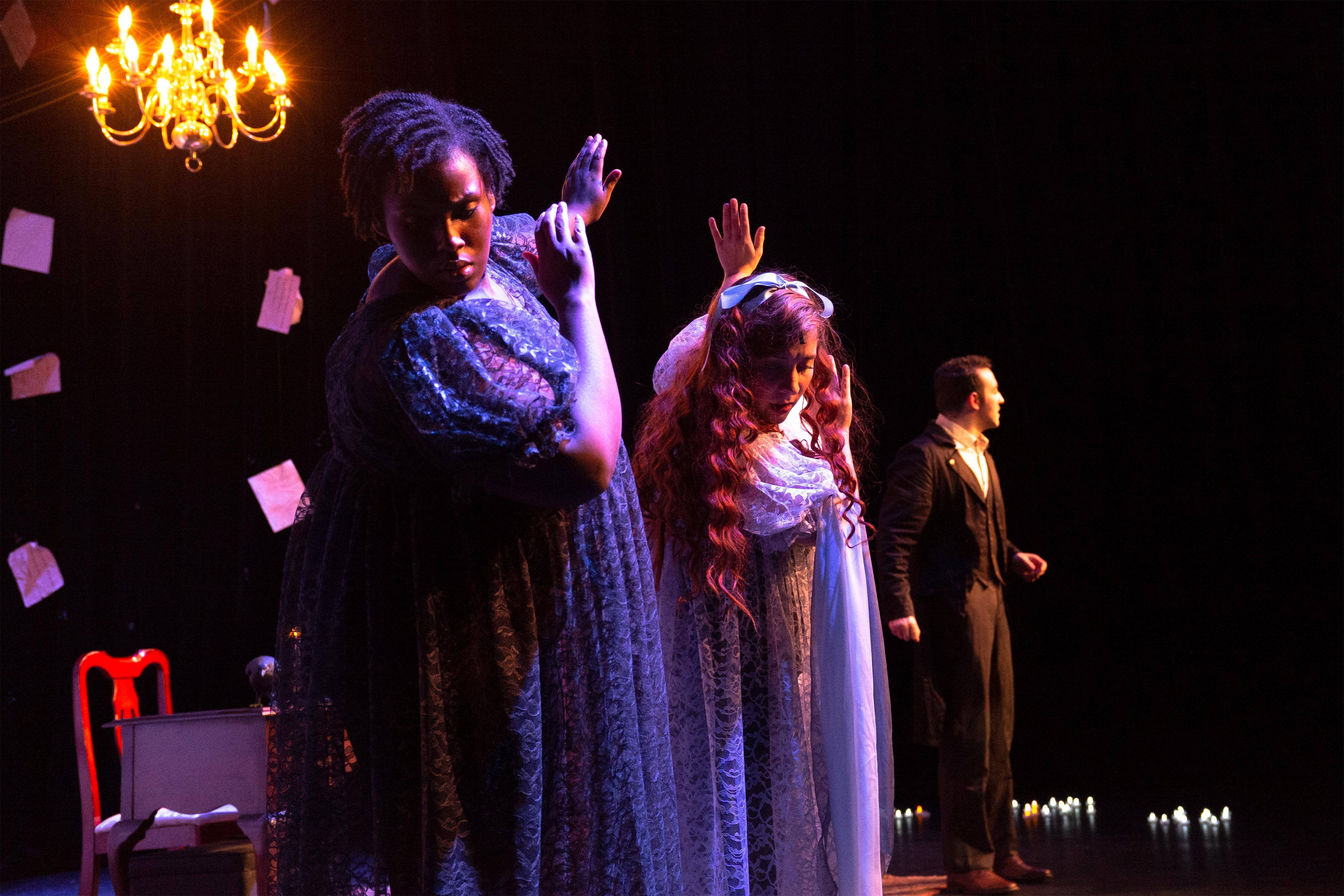 Two women tilted away from Edgar