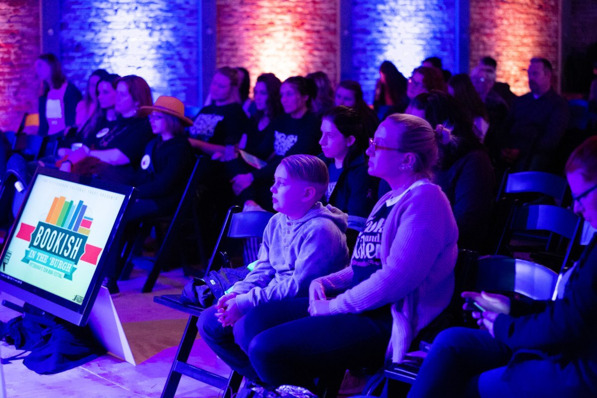 crowd of teens and parents listen attentively Bookish in the 'Burgh