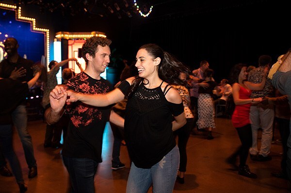 man and woman dance at an event in Pittsburgh's Cultural District