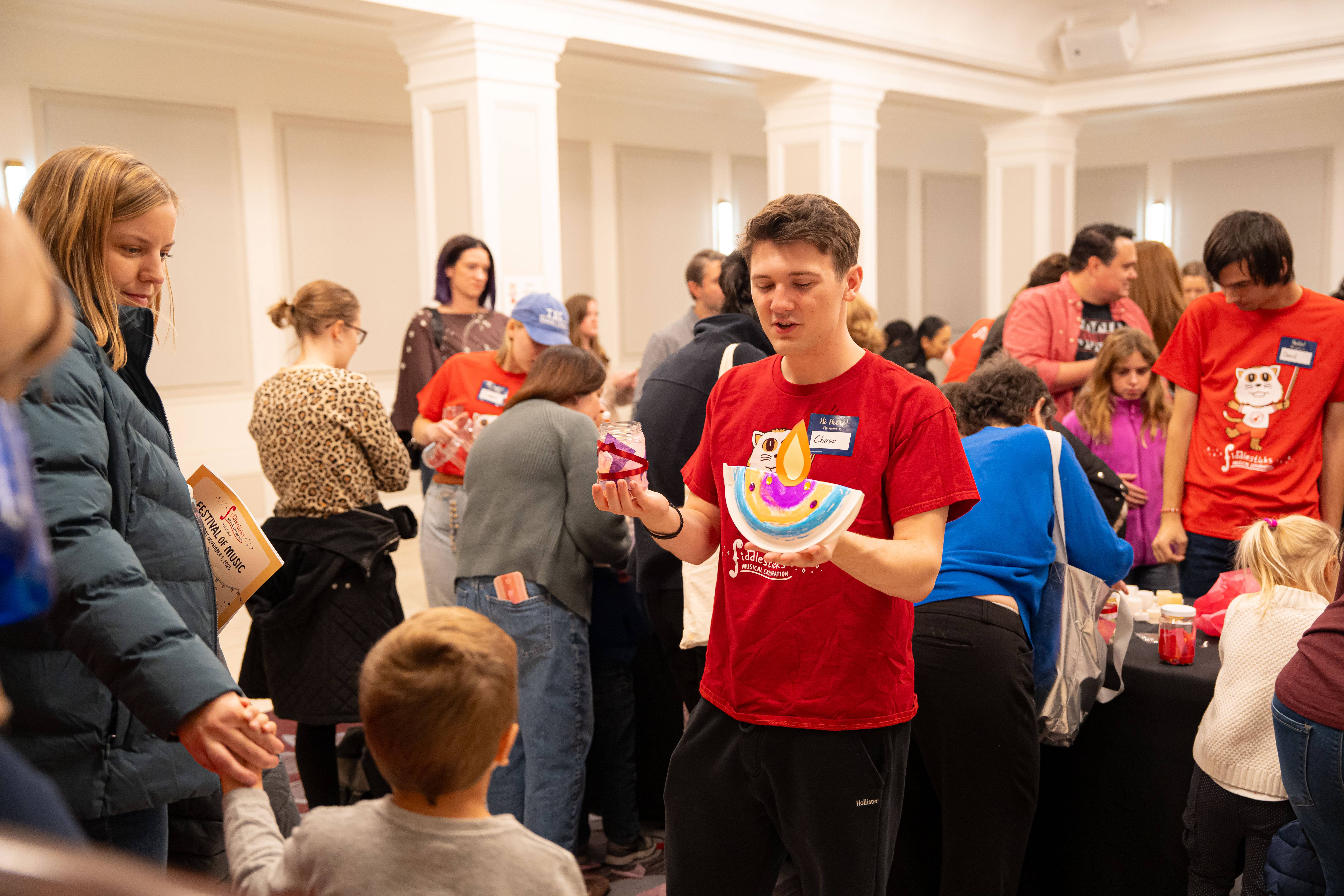 Fiddlesticks volunteers helping families at Heinz Hall